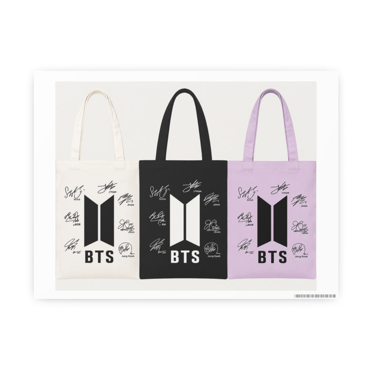 Three tote bags in white, black, and lilac, each displaying a black logo with the letters "BTS" and signatures. The have long handles and are presented on a light-coloured surface. The are...